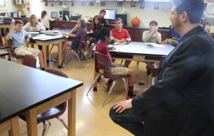 Dr. Marcus fields a question from a St. Cyril middle school student.